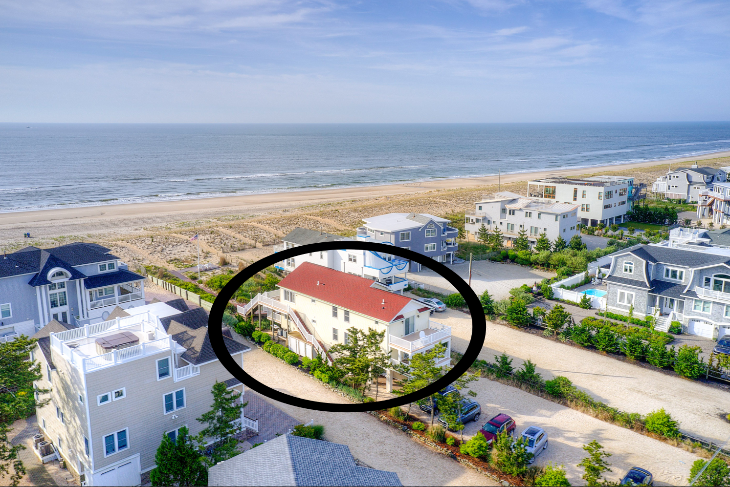 First floor of oceanfront duplex with beach AND bay views.